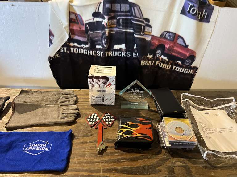 Mystery lot of assorted items to include respirators, CDs, THROW HAS A SIGN LETTER FROM FORD MOTOR CO.PRESIDENT, gloves, and more. See pictures for details. image