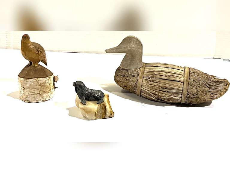 Home decor to include a metal walrus on Stone, believed to be vintage Marvin Wernick, vintage carved bird sculpture, and a corn husk/reed duck decoy, see pictures for details. image