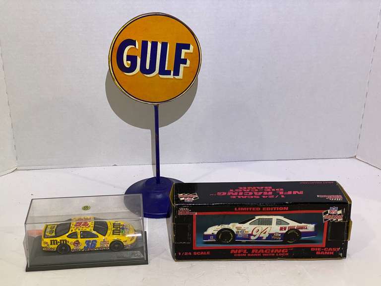 #36, Ernie Irvan diecast stock car replica with display case, also includes #94, diecast stock car coin bank, and a Gulf table sign, see pictures for details. image