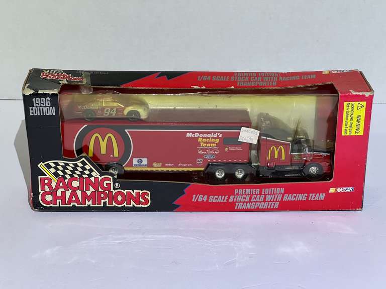 McDonald’s diecast stock car miniature with racing team transport replicas, comes in original packaging, see pictures for details. image
