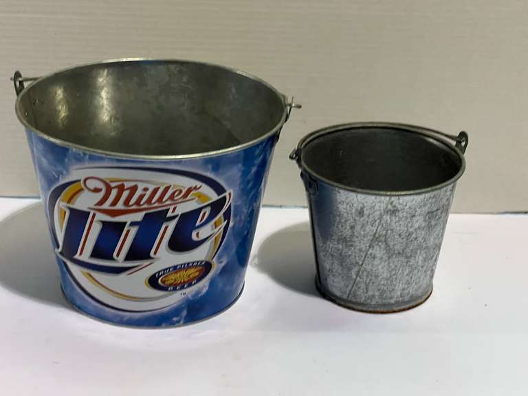 Galvanized buckets to include a Miller light beer bucket, see pictures for details. image