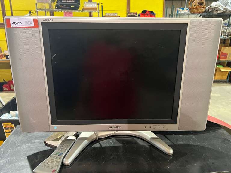 Sharp 20” liquid crystal TV, powers up, comes with remote, see pictures for details. image