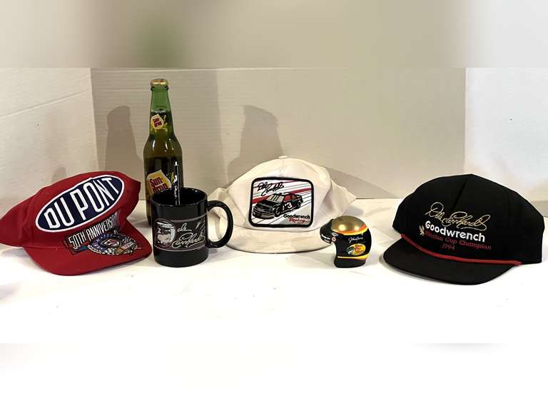 Dale Earnhardt memorabilia to include a coffee mug, tire gauge, caps, helmet replica, and more. See pictures for details image