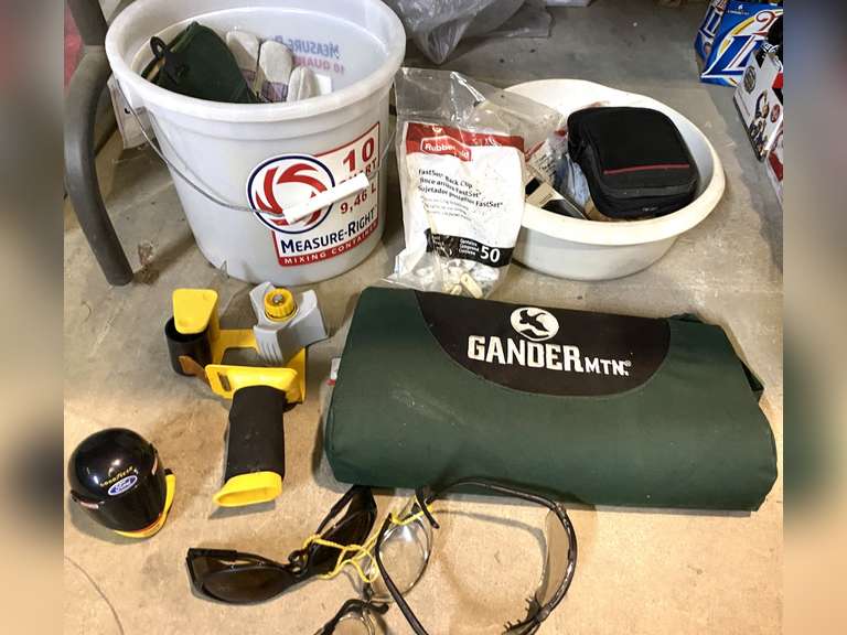 Mystery lot of assorted items to include safety glasses, diecast replica, garden kneeling mat, gloves, and more. See pictures for details. image