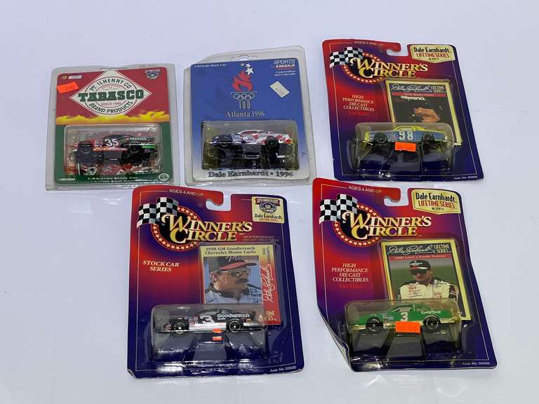 Assorted diecast stock car miniature replicas, featuring Dale Earnhardt, and Todd Bodine, five pieces, all pieces are still in original packaging, see pictures for details. image