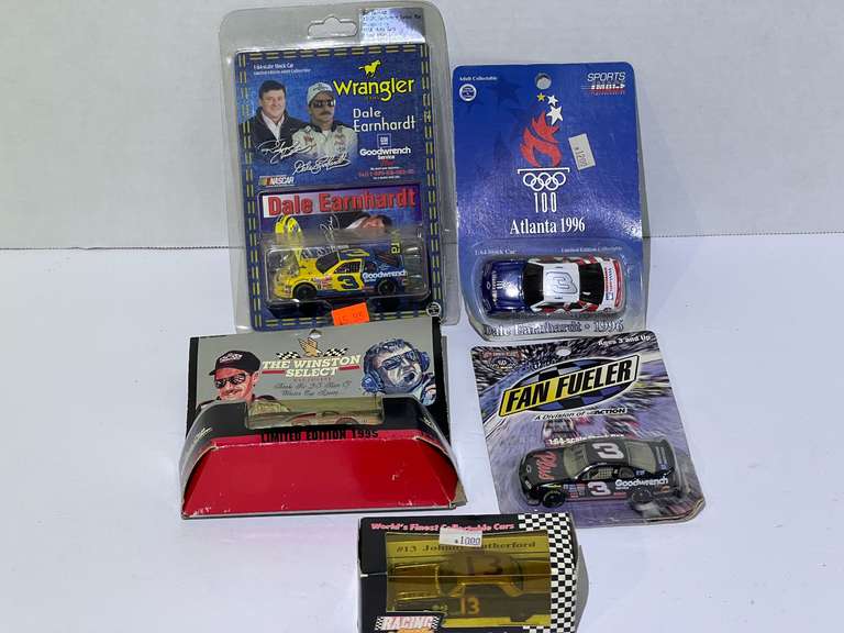 Assorted diecast stock car miniature replicas, featuring Dale Earnhardt, and Johnny Rutherford, five pieces, all pieces are still in original packaging, see pictures for details. image