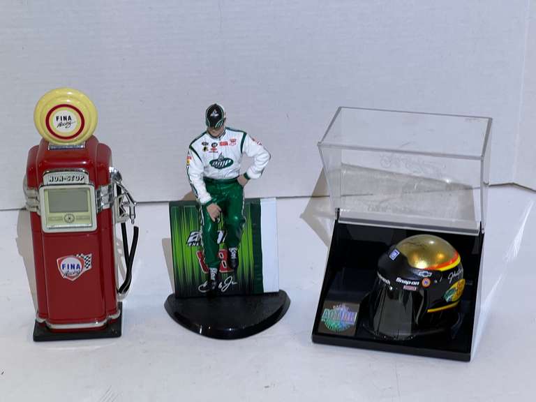 Dale Earnhardt helmet replica with display case, Fina racing,  battery operated gas pump replica, and Dale Earnhardt Jr. figurine with stand, see pictures for details. image