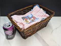 BASKET FILLED WITH THEMED DISH RAGS
