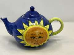 LR… World Bazaars sun face teapot, see pictures for details.
