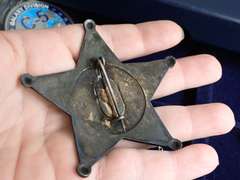 COIN COLLECTOR BOX & CONTENTS - INCLUDES HEAVY METAL SHERIFF BADGE, CROSS NECKLACE, C-5 AIR FORCE MEDALLION & MORE