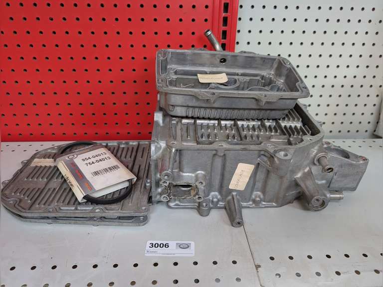 CUB CADET BELT AND ALUMINUM OIL COOLER COVER, ALUMINUM SIDE COVERS, AND ALUMINUM COVER CASE, FITMENT UNDETERMINED. image