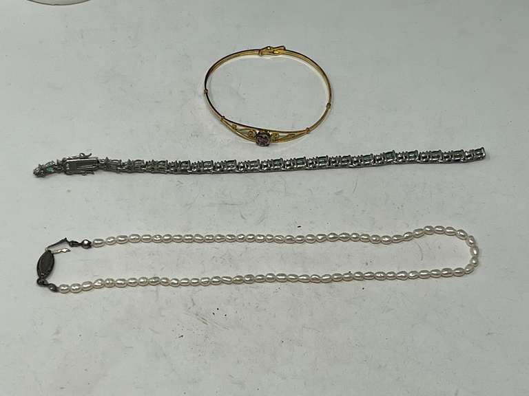 Lovely ladies jewelry to include a dainty pearl necklace, tennis bracelet with faceted green stones, this piece needs a link repair, also includes a Kiddie Kraft bangle bracelet, stamped 12 KGF, see pictures for details. image