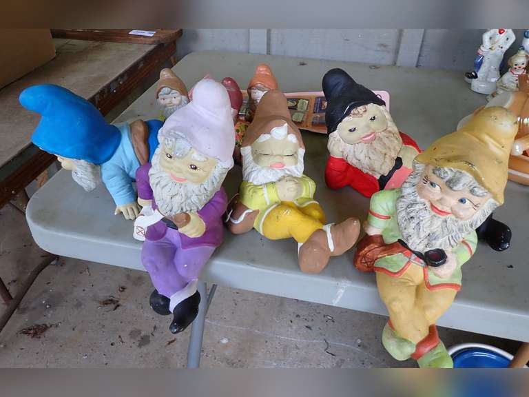 Collection of Decorative Garden Gnomes and Disney Snow White Pins image