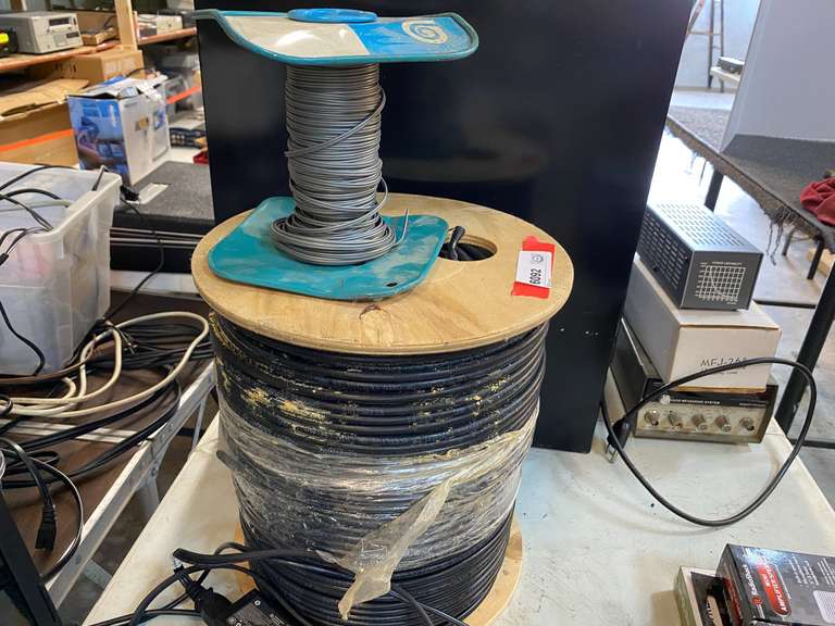 Small spool of cable, believed to be Cat 6, 18 AWG, also includes a small partial role of 20 AWG stranded parallel cable, see pictures for details. image