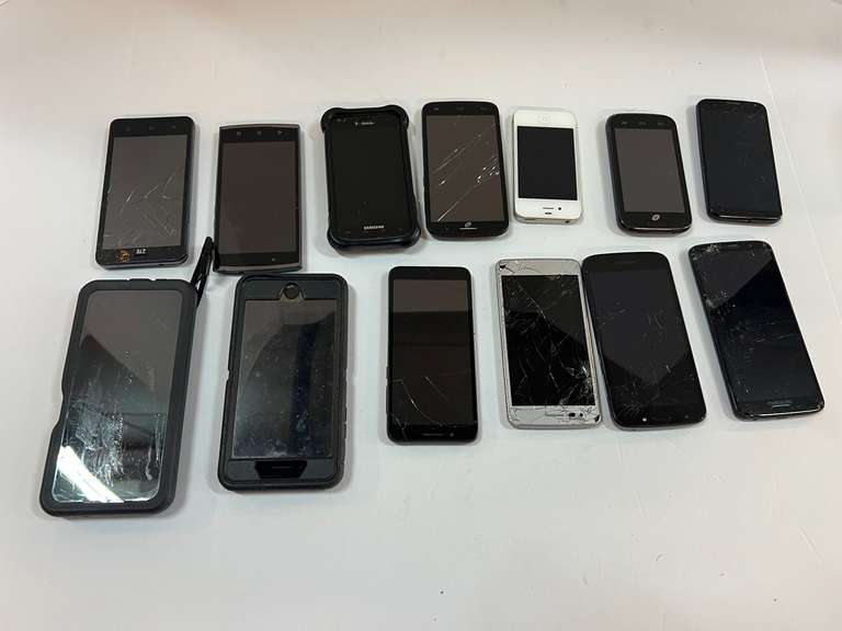 Large cell phone assortment, a lot of these have cracked screens, tub is not included, see pictures for details. image