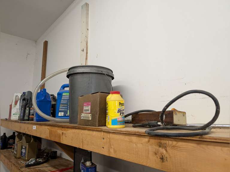 MARINE ENGINE OIL, HONDA OUTBOARD THROTTLE BODY, BRAKE FLUID & OTHER AUTOMOTIVE SUPPLIES ON TOP SHELF AND FAR LEFT HAND SIDE OF MIDDLE SHELF MARKED 2181 image