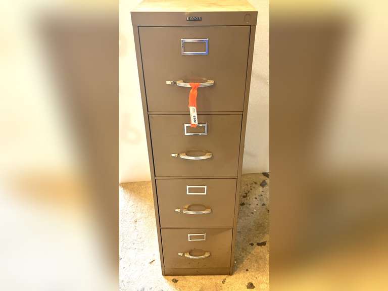 Metal four drawer filing cabinet, see pictures for details. image