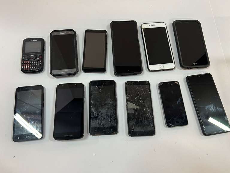 Large cell phone assortment, some have cracked screens, tub is not included, see pictures for details. image