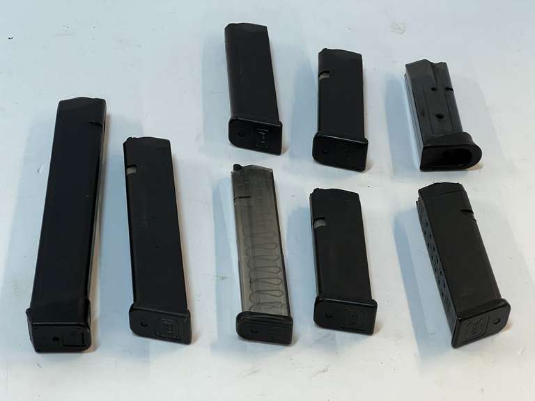 Assortment of magazines, includes five Glock magazines, eight pieces total, tub is not included, see pictures for details. image