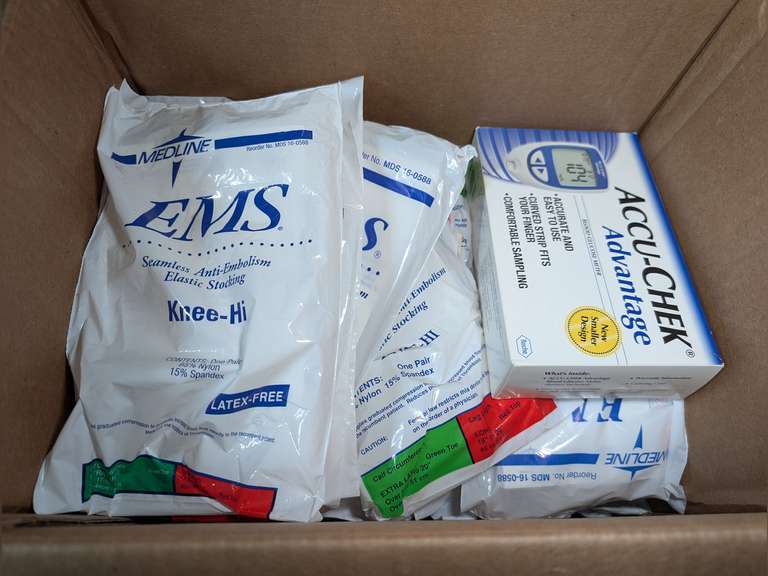 BOX FILLED WITH MEDLINE EMS SEAMLESS ANTI-EMBOLISM ELASTIC STOCKINGS AND ACCU-CHEK ADVANTAGE BLOOD GLUCOSE METER image