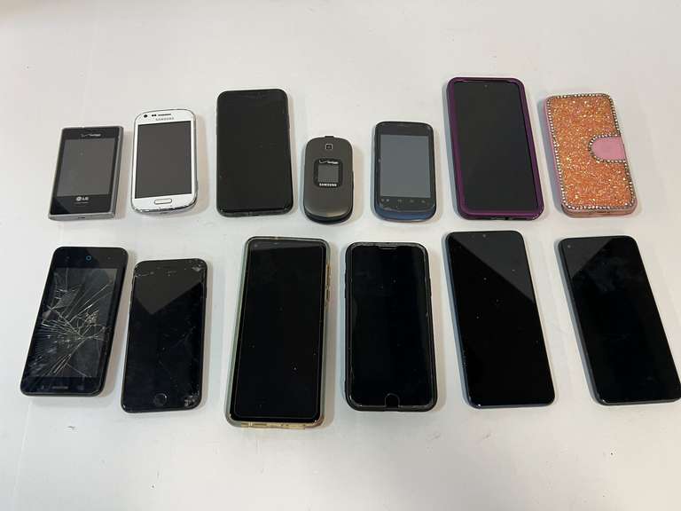Cell phone assortment, some with cracked screens, tub is not included, see pictures for details. image