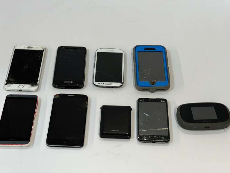 Cell phone assortment, some with cracked screens, tub is not included, see pictures for details. image