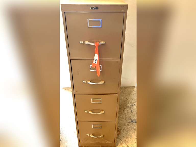 Metal four drawer filing cabinet, see pictures for details. image