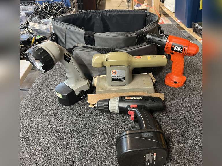 Soft bag of assorted power tools to include a Black & Decker dual action sander, powers up, also includes a Craftsman 18 V Powermate cordless drill, with battery, no charger, also includes a Black & Decker 9.6 V cordless drill, no battery, no charger, and cordless flashlight with battery, no charger. See pictures for details. image