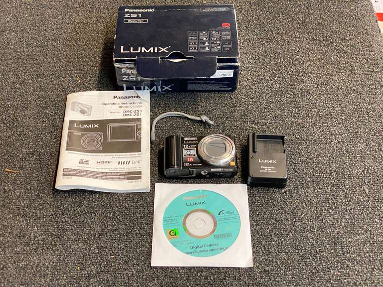Panasonic Lumix digital camera with battery charger, comes in original box, see pictures for details. image