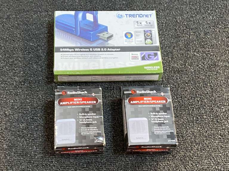 RadioShack mini amplifier/speakers, set of two, also includes a Trendnet 54MBPS wireless G USB 2.0 adapter, still new in the box, see pictures for details. image