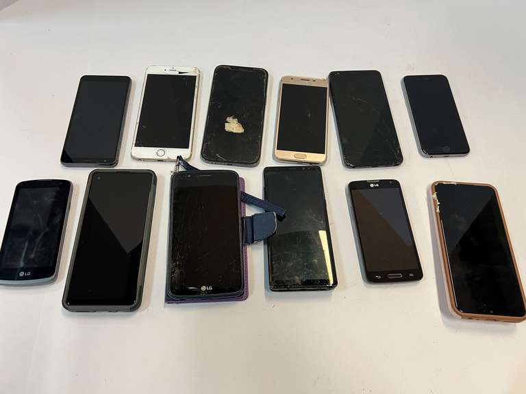 Cell phone assortment, some with cracked screens, tub is not included, see pictures for details. image