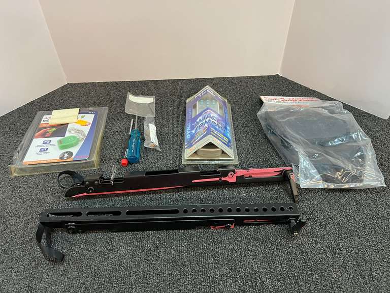 Assorted small hand tools, TV bracket, remote control, and more. Tub is not included, see pictures for details. image