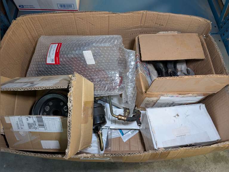 LARGE BOX FILLED WITH NEW AND USED MARINE AND RV PARTS INCLUDING PULLEY, FUEL RAIL ASSEMBLY, MECHANICAL FUEL PUMP, WINDSHIELD WIPER ARM, GASKETS, SEALS, THERMOSTATS, FILTERS, WIRING, FUSES, AND MORE image