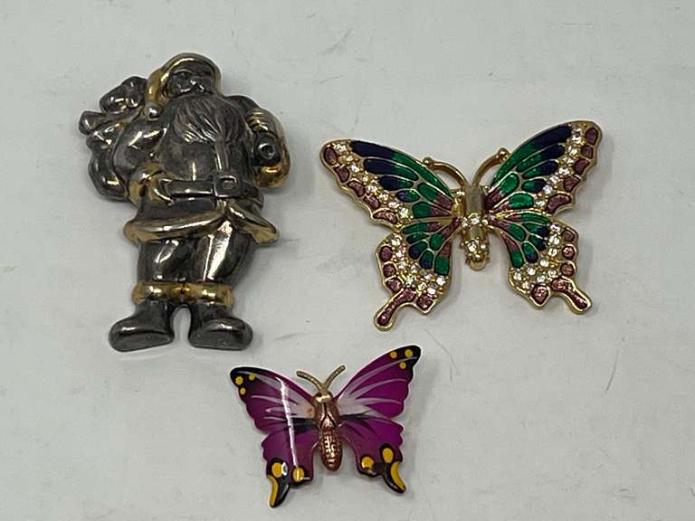 Vintage gold and silver tone Santa brooch, can be worn as a pendant, also includes an enamel and rhinestone butterfly brooch as well as a smaller enameled butterfly brooch, see pictures for details. image