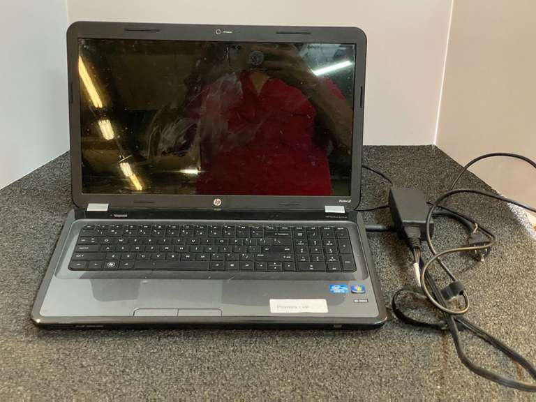 HP pavilion G series laptop, powers up, working condition unknown, see pictures for details. image