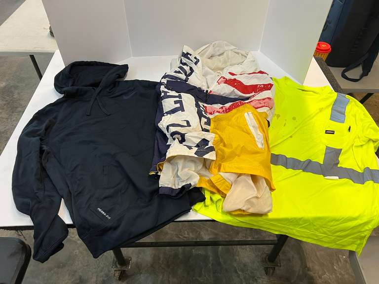 Nike hoodie, shower liner, safety shirt, and more. See pictures for details. image