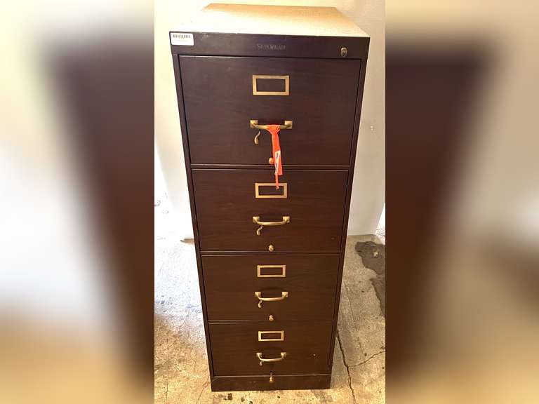 Metal four drawer filing cabinet, see pictures for details. image