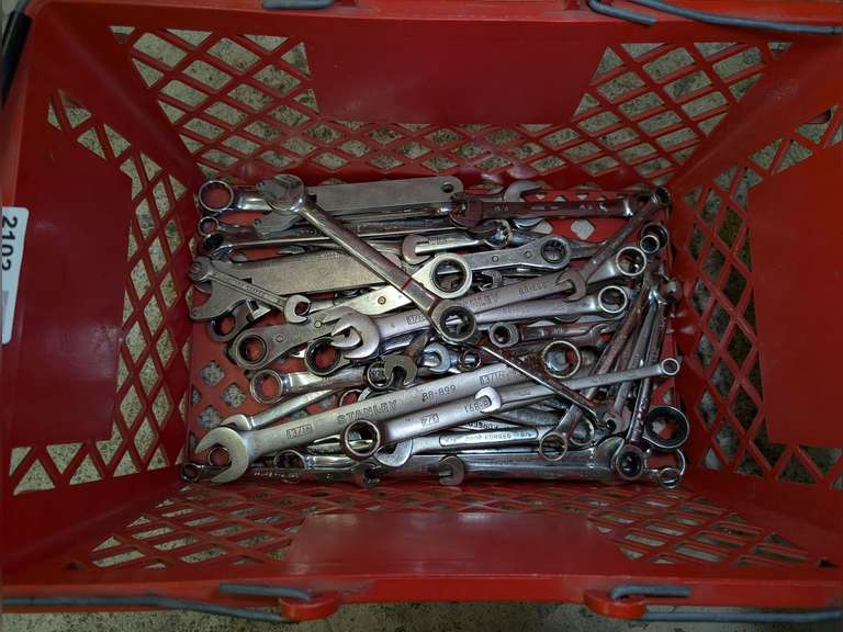 STAPLES BASKET FILLED WITH COMBINATION WRENCHES, RATCHETING BOX WRENCHES, AND MORE image