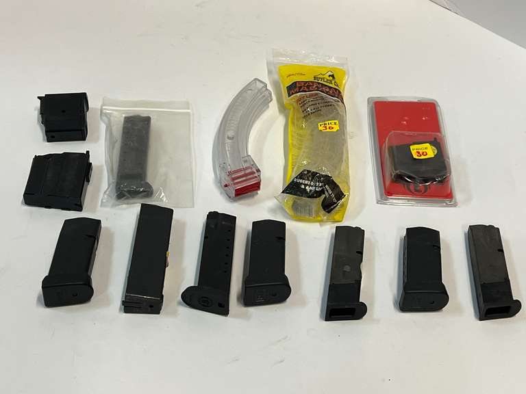 Large assortment of magazines to include Glock, Smith & Wesson, and more. Two pieces are still in original packaging, 13 pieces total, see pictures for details. image