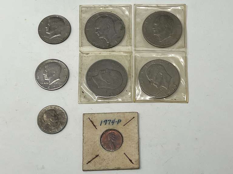 Collectible coins to include four Eisenhower dollars, two Kennedy half dollars, a Susan B Anthony dollar, and a 1974 – P penny, see pictures for details. image