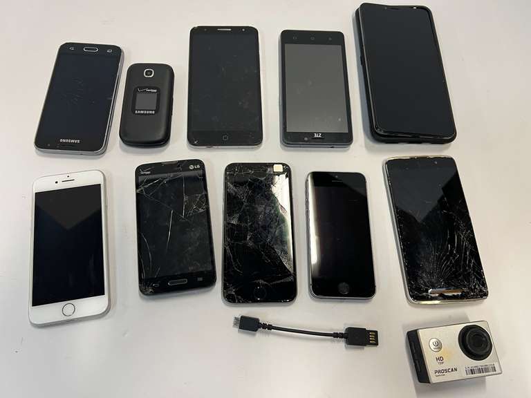 Assorted cell phones, some with cracked screens, also includes an HD 720 P pro scan sports cam, see pictures for details. image