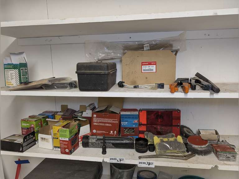 ALL ITEMS ON TOP TWO SHELVES INCLUDING FASTENERS, TRAILER LIGHTS, UNUSED BRAKE PADS, SPECIALTY TOOLS, AND MORE image
