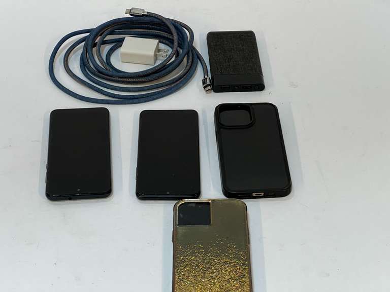 Cell phones, charging cord, and portable battery charger. See pictures for details. image