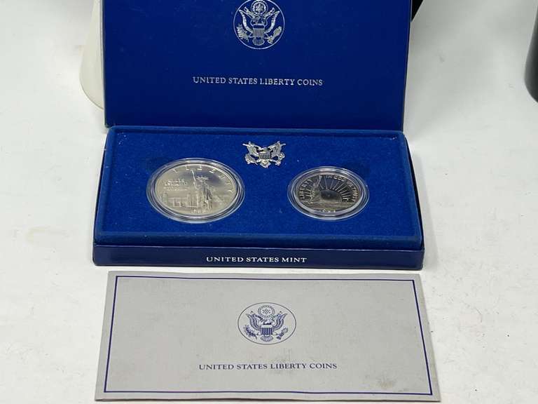 1986 uncirculated Liberty silver dollar from the Philadelphia mint, .900 fine silver, also includes a 1986 uncirculated Liberty half-dollar from the Denver mint. See pictures for specification details. image