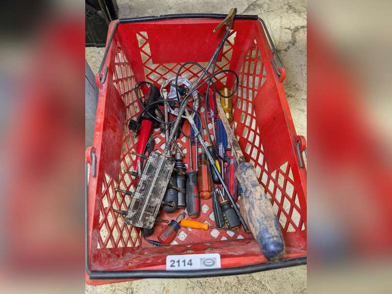 STAPLES BASKET FILLED WITH SCREWDRIVERS, 8-PIN IGNITION TESTER, PRY BAR, AND MORE image