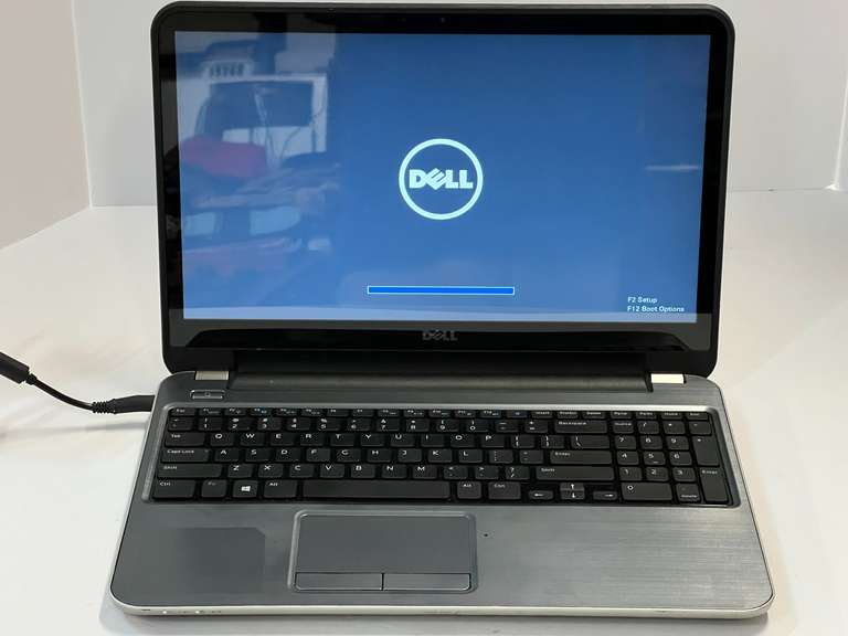 Dell laptop, comes with charging cord, working condition unknown, see pictures for details. image