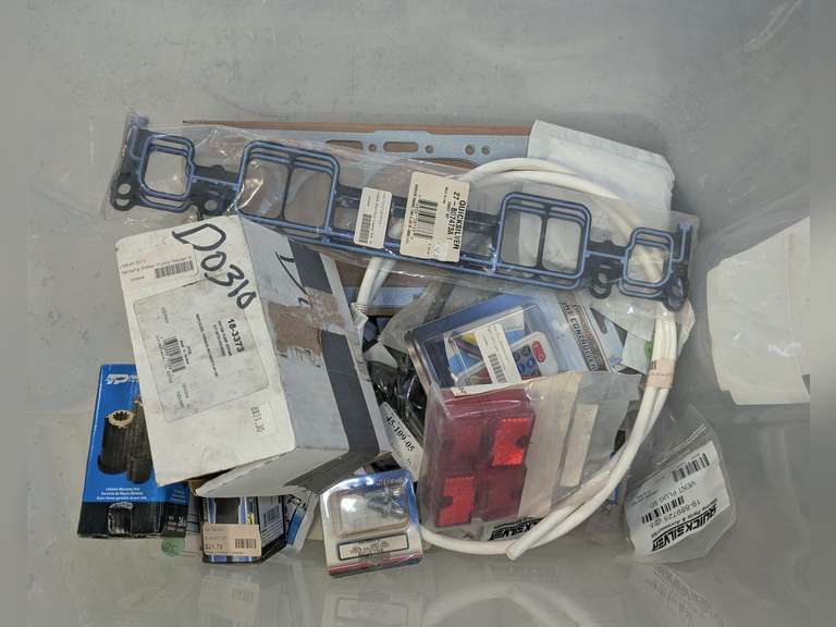 TUB FILLED WITH MARINE PARTS INCLUDING GASKETS, YAMAHA WATER PUMP KIT, TURNING POINT PROPELLER HUBS, IMPELLERS, TRILER PARTS, FUSES, CARB PARTS, FASTENERS, AND MORE image