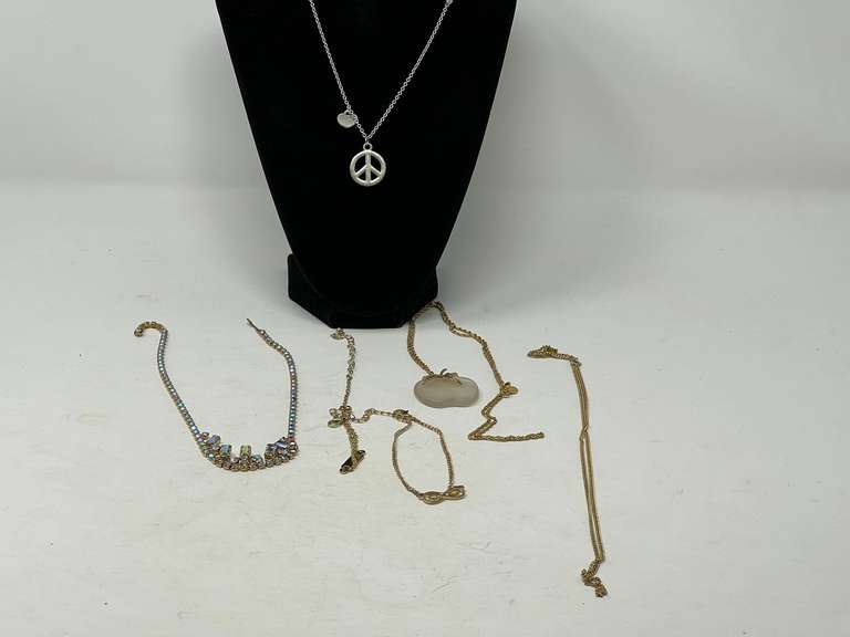 Lovely ladies fashion jewelry to include a frosted apple pendant necklace by Avon, an aurora borealis rhinestone choker, beaded peace sign necklace, and more. See pictures for details. image