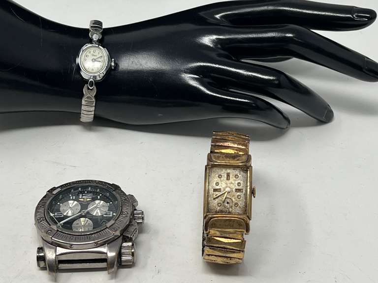 Men’s and ladies watches, includes Breitling, no band, also includes a ladies Timex, also includes a damaged watch for parts, see pictures for details. image