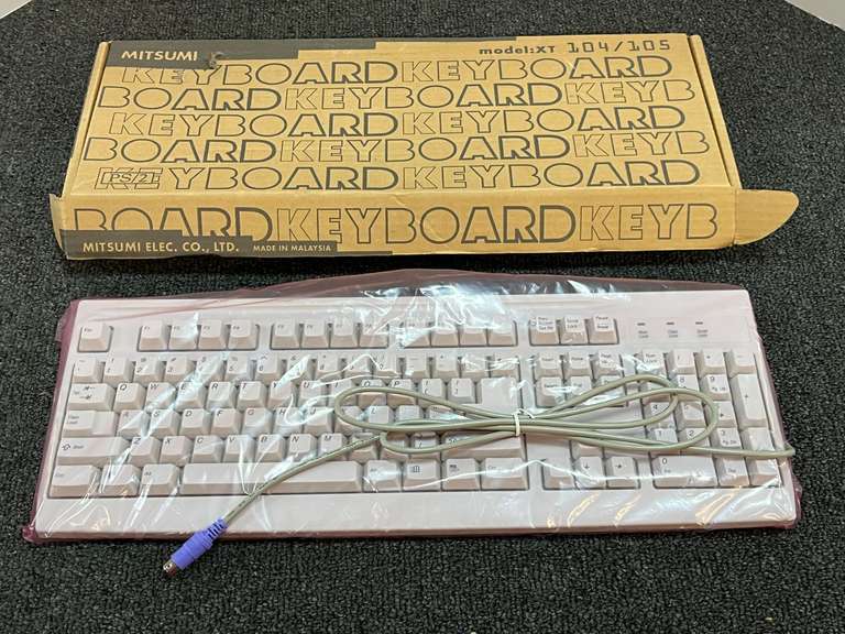 Mitsumi computer keyboard, still new in the box, see pictures for details. image